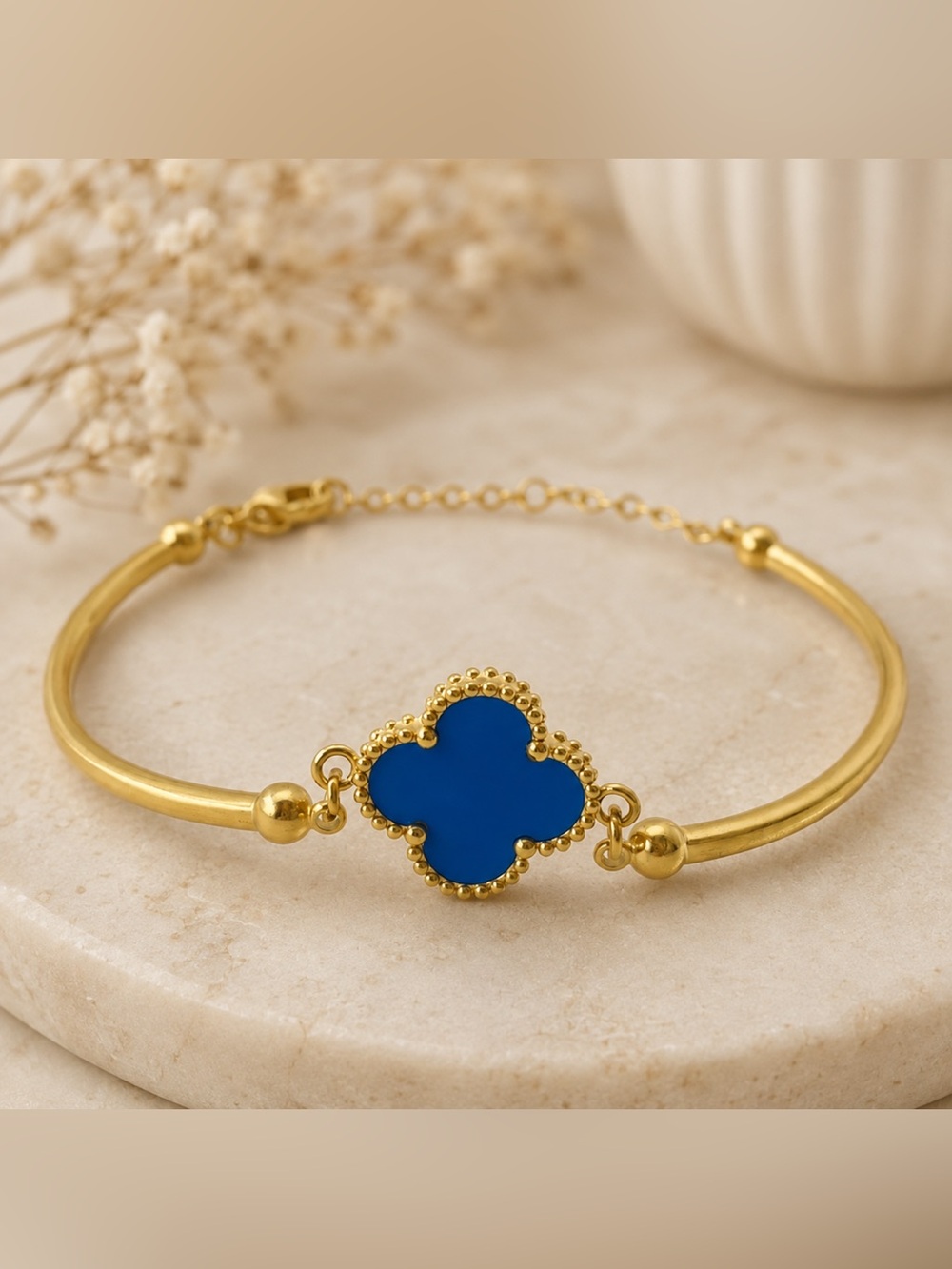 Elegant Gold Bracelet with Blue Clover Accent